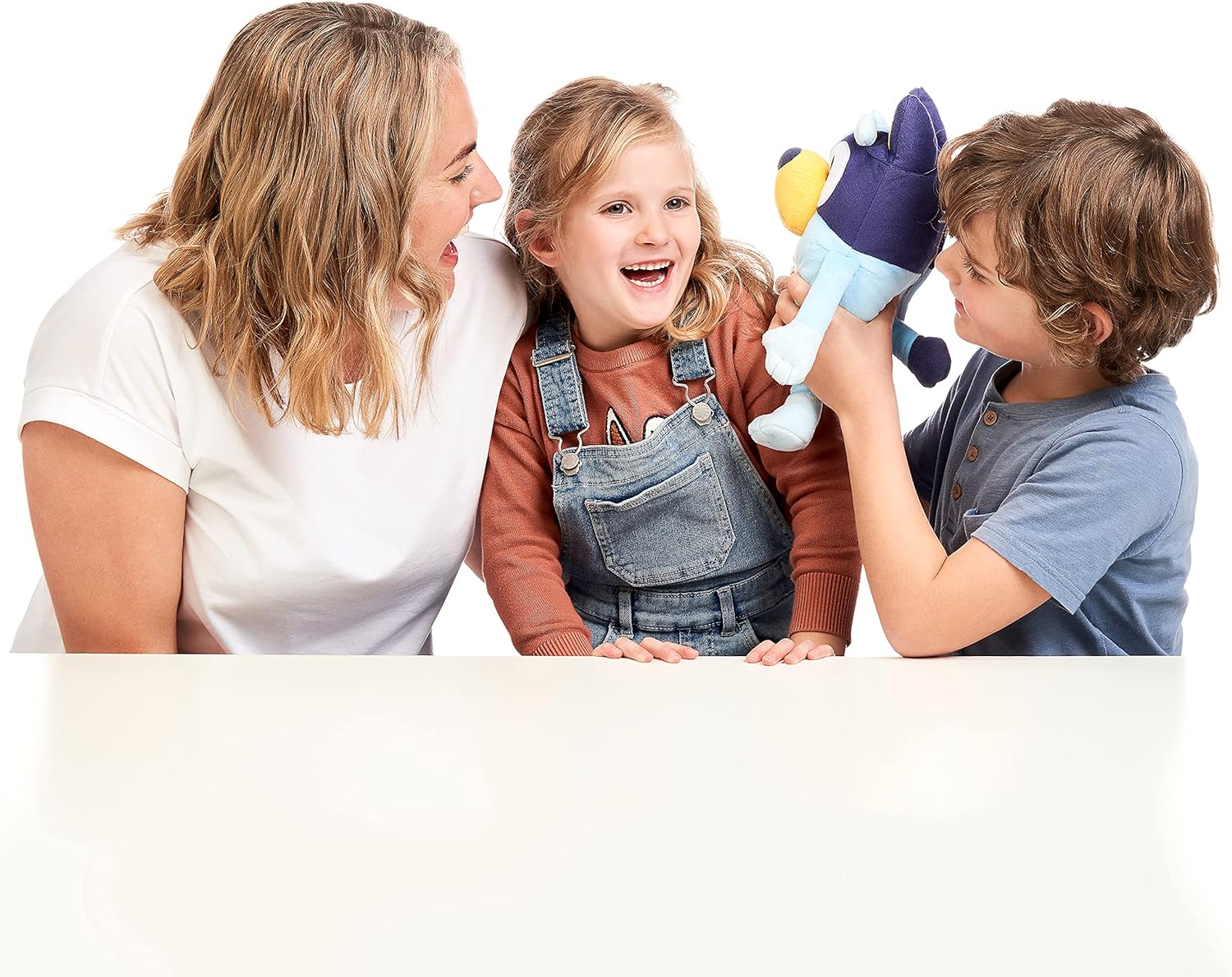 Family playing together with Bluey talking plush puppet