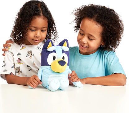 Two children playing with Bluey talking plush toy